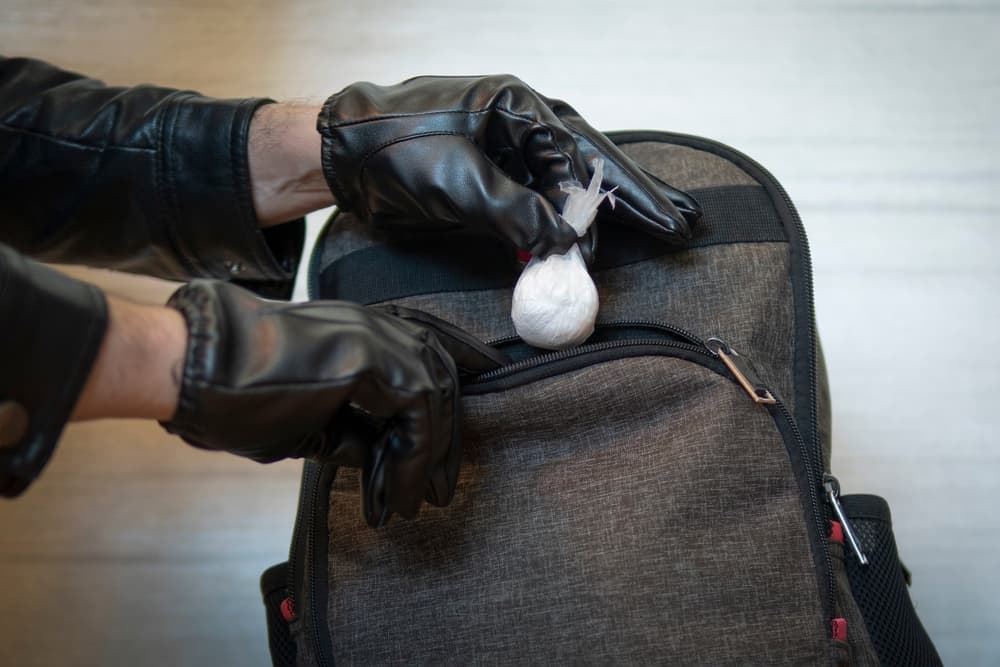 The drug courier was caught by the police.